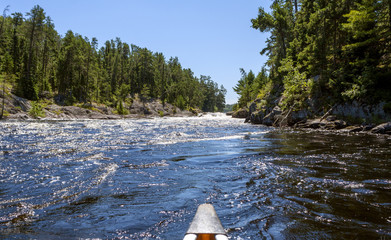 Paddling in the Quetico Provincial Park and Boundary Waters Canoe Area Wilderness