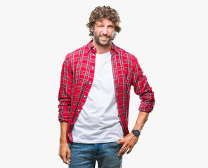 Handsome hispanic model man over isolated background winking looking at the camera with sexy...