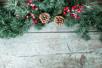 Christmas decoration of mistletoe, holly with berries,ivy and pine cones