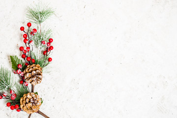 Christmas decoration of mistletoe, holly with berries,ivy and pine cones