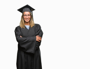 Young beautiful woman wearing graduated uniform over isolated background happy face smiling with crossed arms looking at the camera. Positive person.