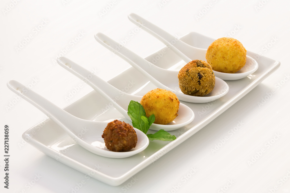 Wall mural Fried meat balls in a white plate on white background with copy space