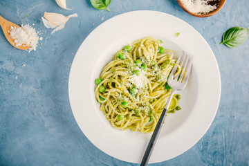 Tasty pasta with pesto served on plate