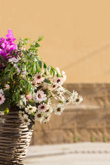 a bouqet wild flowers, basket of wildflowers on a bicycle, vertical photography, copy space
