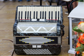 Classic musical instrument an accordion in black color onstage