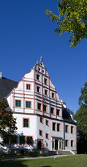Fototapeta premium Ponitz / Germany: Renovated Renaissance manor house with Neo-Gothic portal on a sunny day in October