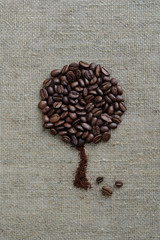 Coffee tree made of coffee beans on burlap rustic rough simple beautiful.
