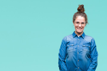 Beautiful young brunette curly hair girl wearing glasses over isolated background with a happy and cool smile on face. Lucky person.