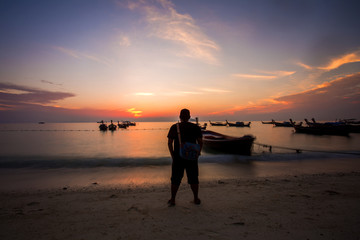 Fototapeta premium sunrise scenery at Koh Lipe Island,Thailand. Soft focus,Blur due to Long Exposure. Visible Noise due to High ISO.