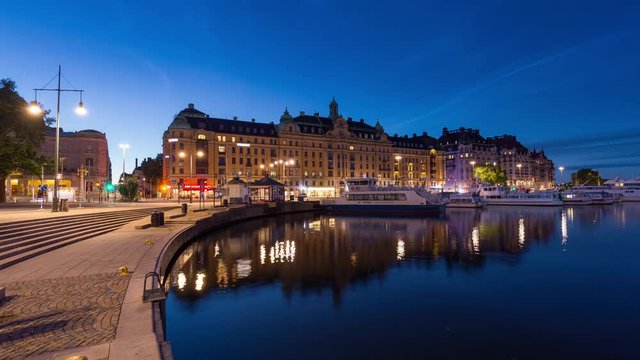 Night time lapse of the water and road traffic in Norrmalm, Stockholm, Sweden