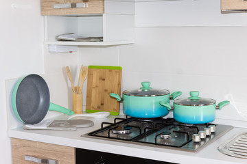 Set of pots, kitchen, stove, cozy new kitchen