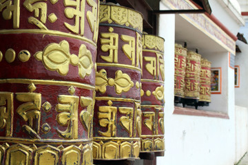 Translation: The prayer flags and wheels around Swayambhunath Stupa in Kathmandu