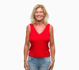 Fototapeta premium Middle age blonde woman over isolated background with a happy and cool smile on face. Lucky person.