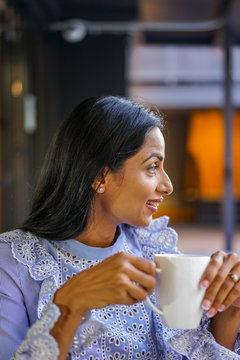 Close up of smiling woman at coffee shop