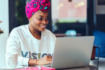 Black woman working on laptop