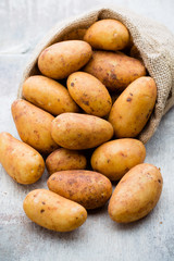 A bio russet potato wooden vintage background.
