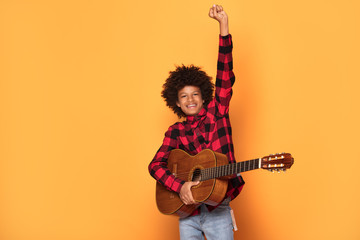 African american teenage boy posing.