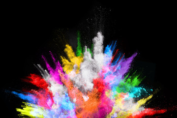Obraz na płótnie Canvas abstract colored dust explosion on a black background.abstract powder splatted background,Freeze motion of color powder exploding/throwing color powder, multicolored glitter texture.