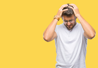 Fototapeta na wymiar Young handsome man wearing glasses over isolated background suffering from headache desperate and stressed because pain and migraine. Hands on head.
