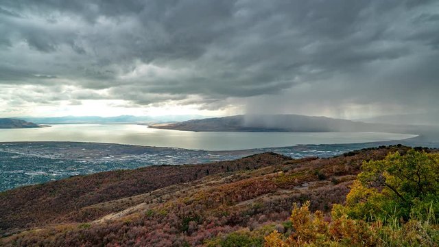 Storm rolling through Utah Valley over Utah Lake viewed from the hills in front of Timpanogos Mountain during Fall.