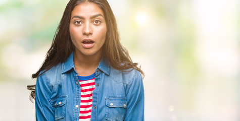 Young beautiful arab woman over isolated background afraid and shocked with surprise expression, fear and excited face.