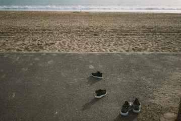 Fototapeta na wymiar Shoes on Beach