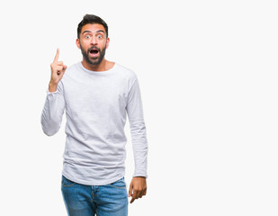 Fototapeta premium Adult hispanic man over isolated background pointing finger up with successful idea. Exited and happy. Number one.