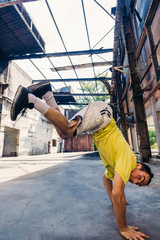 Parkour man exercise handstand outdoors