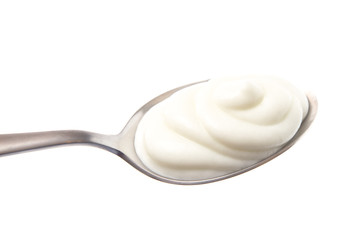 Spoon Full of Yogurt on a White Background