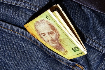 Old Israeli Shekels with a Golda Meer portrait in a jeans pocket