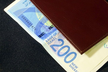 Money of Israel - 200 Israeli shekels in a leather purse