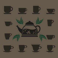 A set of 12 cups of various shapes and a glass teapot with boiling water.