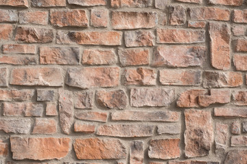 CLOSE UP ORAGNE STONE WALL