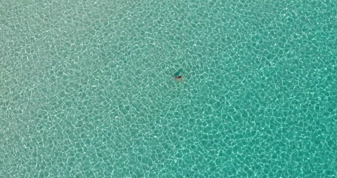 Girl bathing in the sea in Mallorca - Cala Varques beach.