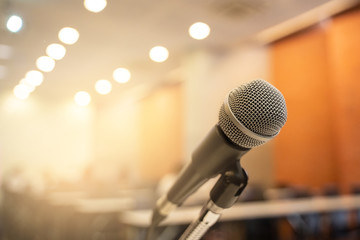 Microphone over the blurred business forum Meeting or Conference Training Learning Coaching Room Concept, Blurred background.