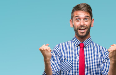 Young handsome business man over isolated background celebrating surprised and amazed for success...