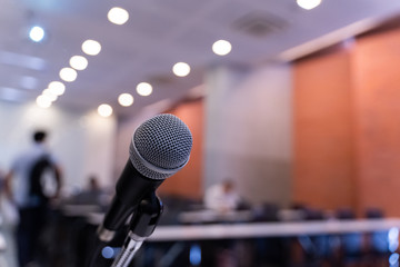 Microphone over the blurred business forum Meeting or Conference Training Learning Coaching Room Concept, Blurred background.