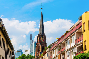 residential buildings, a church and a skyscraper in Frankfurt, Germany