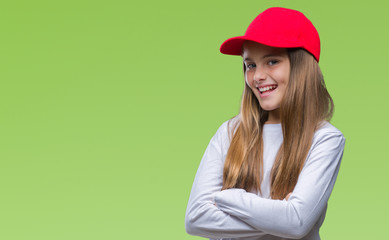 Young beautiful girl wearing red cap isolated background happy face smiling with crossed arms looking at the camera. Positive person.