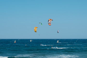 kitesurfer and windsurfer on ocean at El Medano Beach