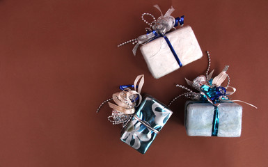 Brown background, gift box and Christmas decorations.