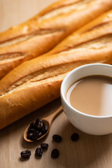 Cup of coffee and baguette french bread
