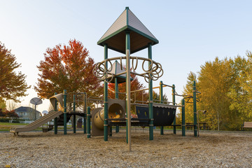 Children Playground in Neighborhood Park in Fall Season