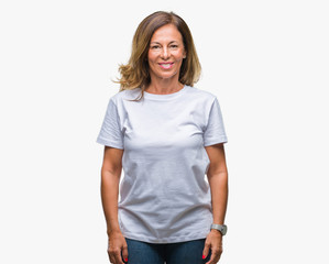 Obraz premium Middle age senior hispanic woman over isolated background with a happy and cool smile on face. Lucky person.