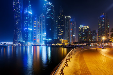 Fototapeta na wymiar Beautiful view to Dubai Marina, UAE. Long exposure time lapse effect at night