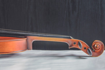 Plakat The violin on the dark table, Classic musical instrument used in the orchestra.