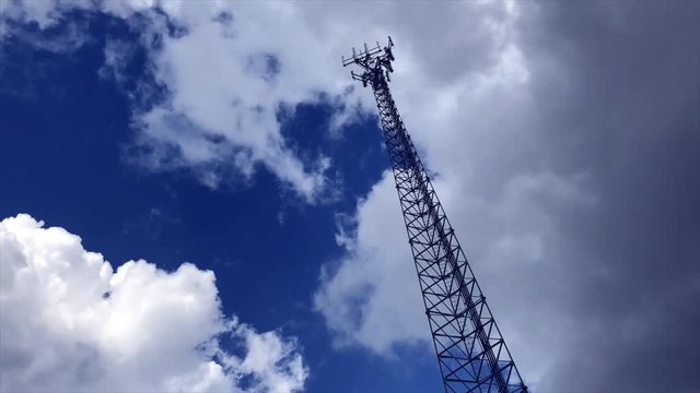 Cell tower against cloud timelapse