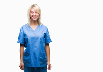 Fototapeta premium Young beautiful blonde nurse doctor woman over isolated background with a happy and cool smile on face. Lucky person.