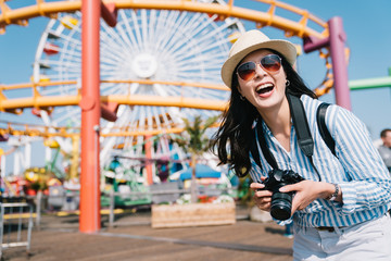 photographer standing in amusement park and