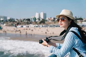 beautiful photographer relaxing nearby the beach